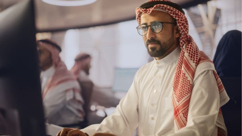 Smart Focused Middle Eastern Worker Working In Family Office