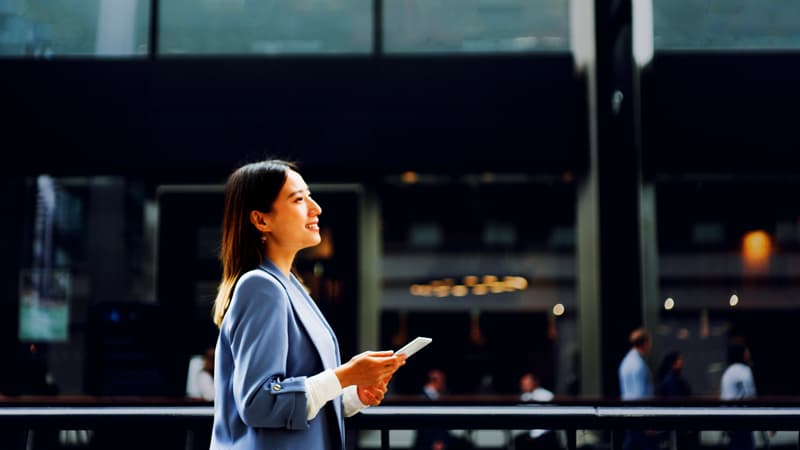 Female In The City With Ipad