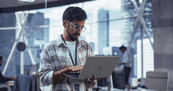 Financial Technology Professional Looking At This Laptop